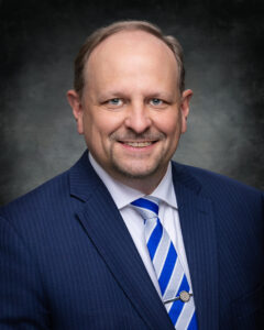 James Copland, Board of Trustee Member, smiling in headshot