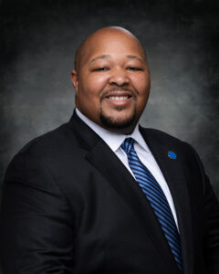 Justin Waddell, Chair of the Board of Trustees, smiling in headshot
