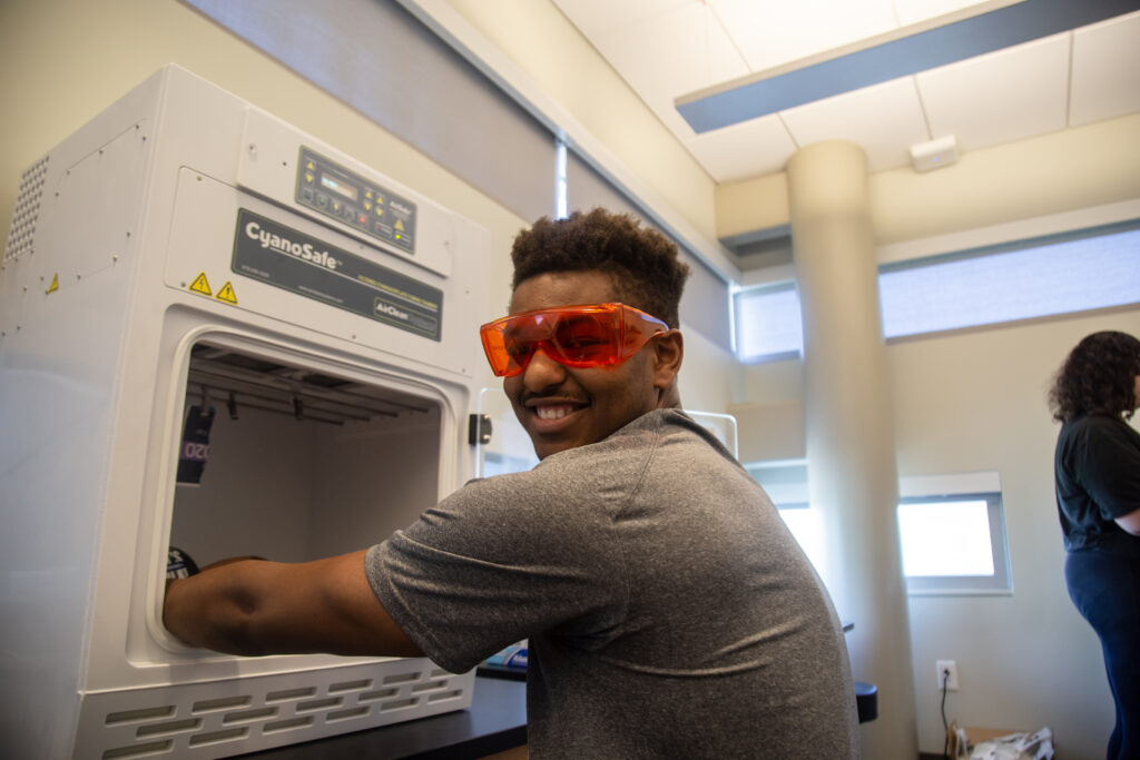 Student working in Crime Lab machines
