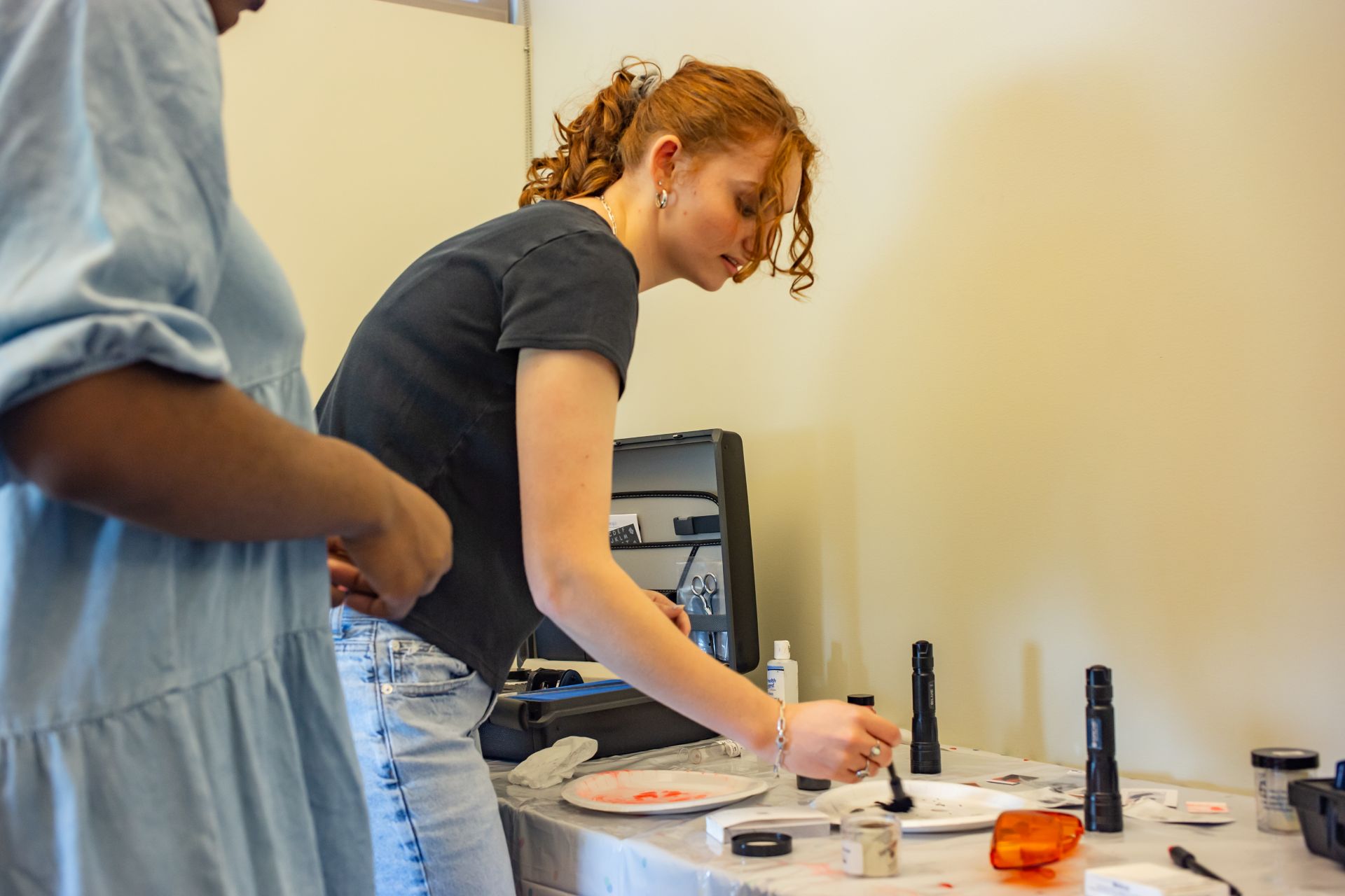 Student in Crime Lab performing analysis in class