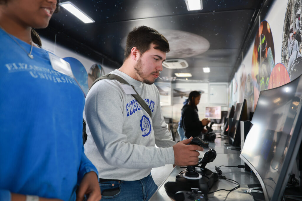 Student using controller for a drone
