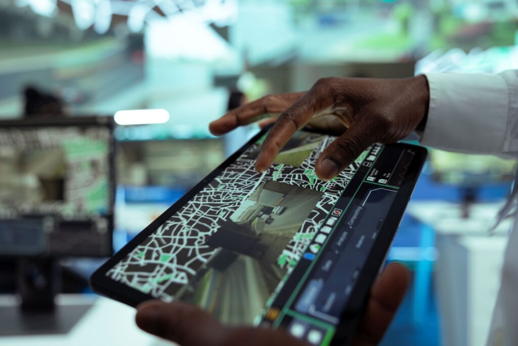 A technology professional uses a tablet in a modern workplace.