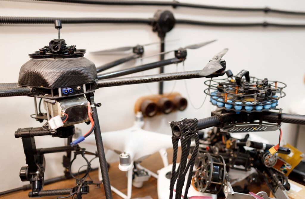 An eye-level view showcases the intricate details of multiple drones, highlighting the technology and engineering involved.