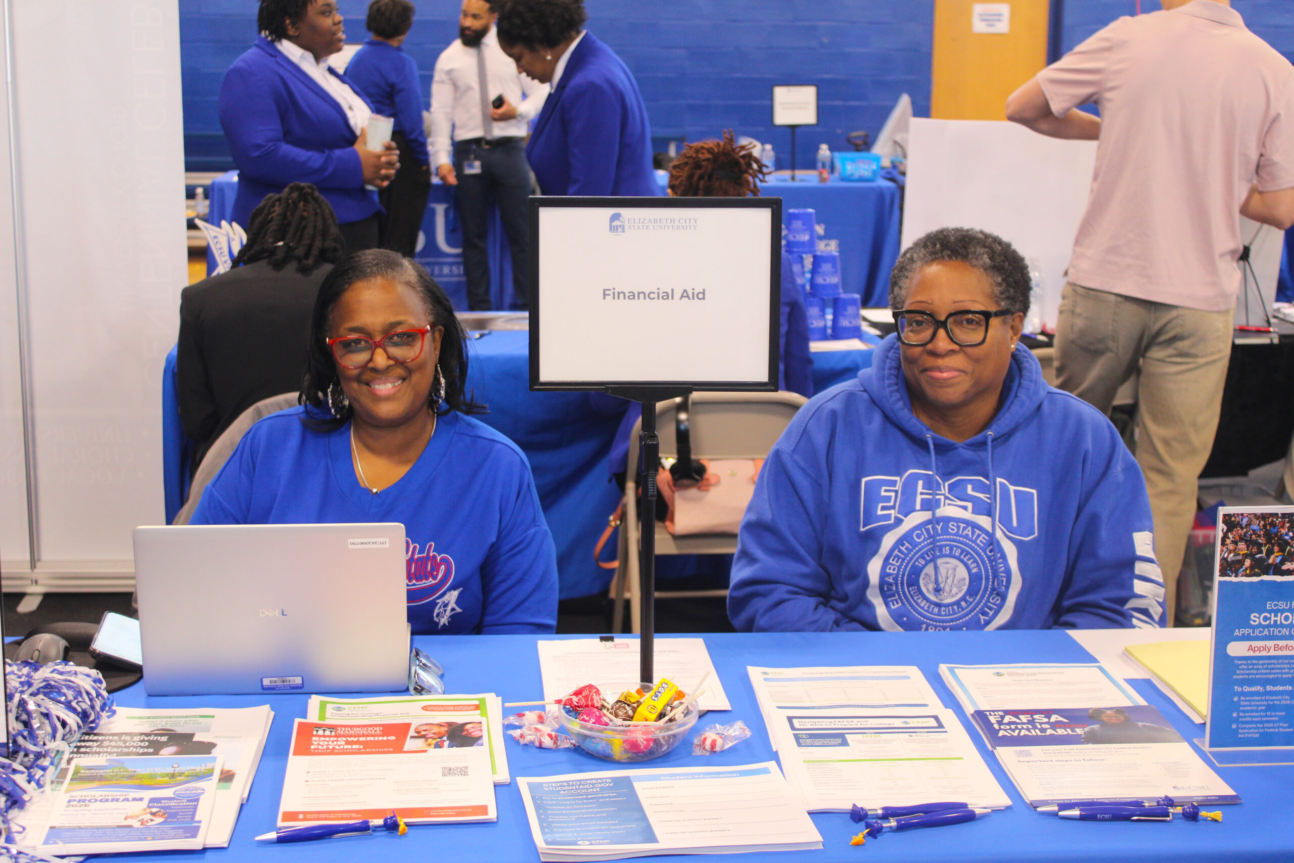 Smiling Financial Aid staff ready to help at ECSU Open House event