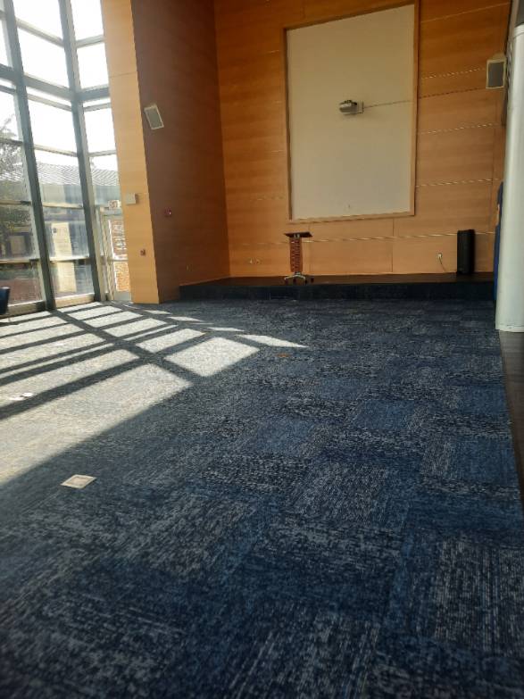 Wide shot of the front of the great hall of the Ridley Student Center. The room is empty to showcase space.