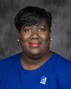 Monet Earle, Director of Alumni Relations & Engagement, smiling in headshot