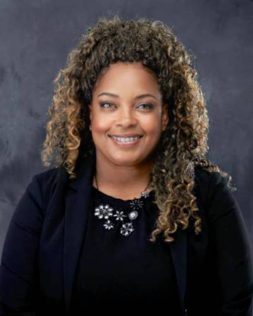 Tameka Gibbs, Assistant Director of Employer Relations & Special Projects for the Career Development Center, smiling in headshot