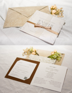 Elegant wedding invitation suite featuring a translucent invitation wrapped with a gold ribbon, coordinating floral-patterned envelope, RSVP card, and event details card. The design uses soft neutral tones, delicate botanical illustrations, and refined typography.